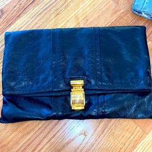 Small black and neon pink clutch purse.